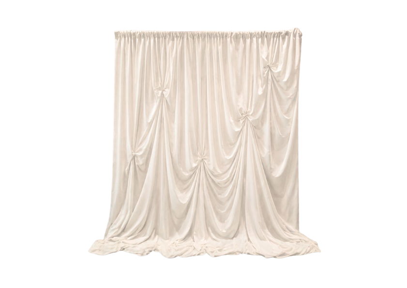 A cream-colored fabric curtain with gathered and draped fabric, hanging from a rod.