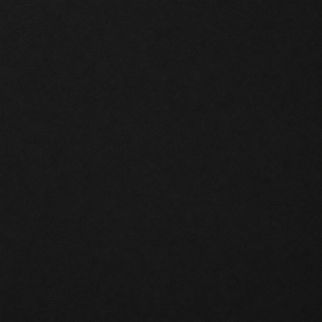 Solid black background with a subtle textured surface.