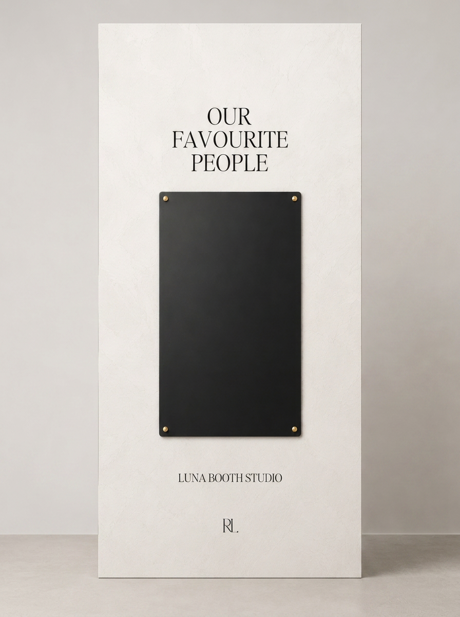 Display board with the text 'Our Favourite People', a black rectangle, and the names 'Luna Booth Studio' and initials 'RL' at the bottom.