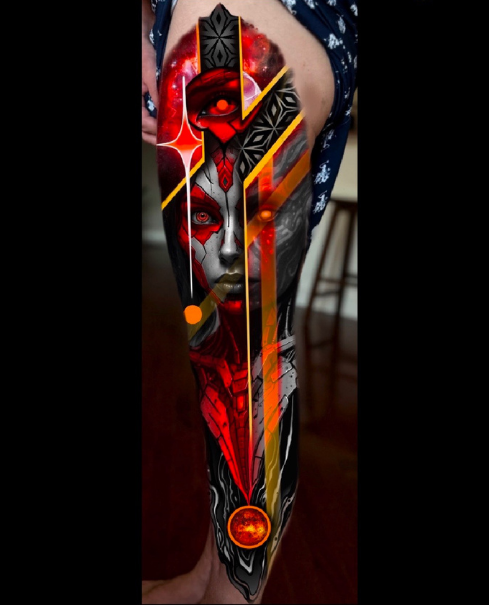 Tattoo of a woman's face with tribal and abstract design elements on a person's leg. Daniel Armitage, Calgary Alberta, Surrealist Tattoo Artist, YYC