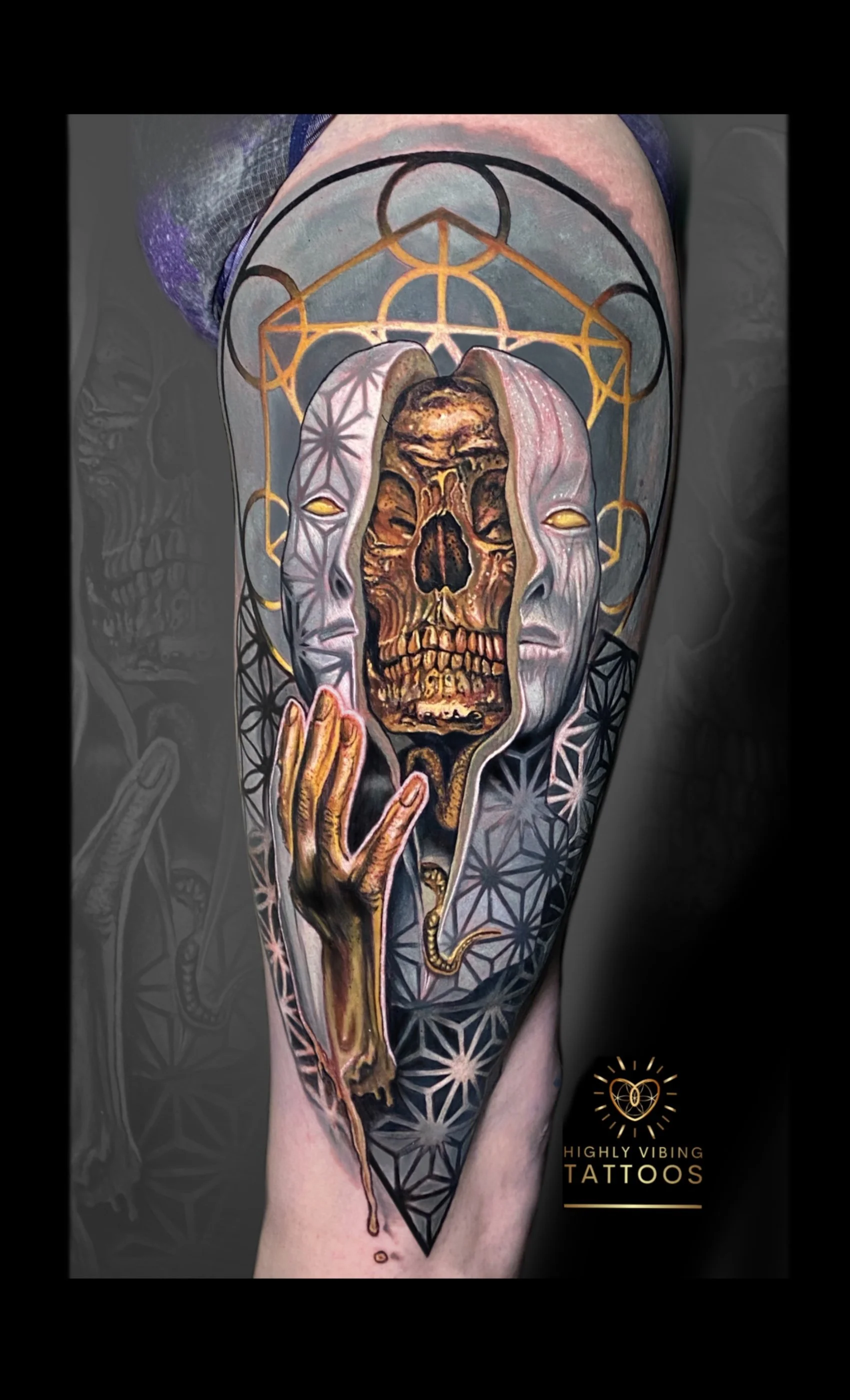 Tattoo of a skull with a hooded figure, geometric patterns, and a hand with a snake on a person's arm. Daniel Armitage, Calgary Alberta, Surrealist Tattoo Artist, YYC