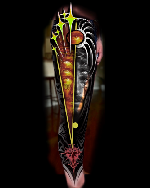 A tattoo featuring dark and vibrant colors, with abstract and surreal elements including faces, eyes, and star-like shapes. Daniel Armitage, Calgary Alberta, Surrealist Tattoo Artist, YYC