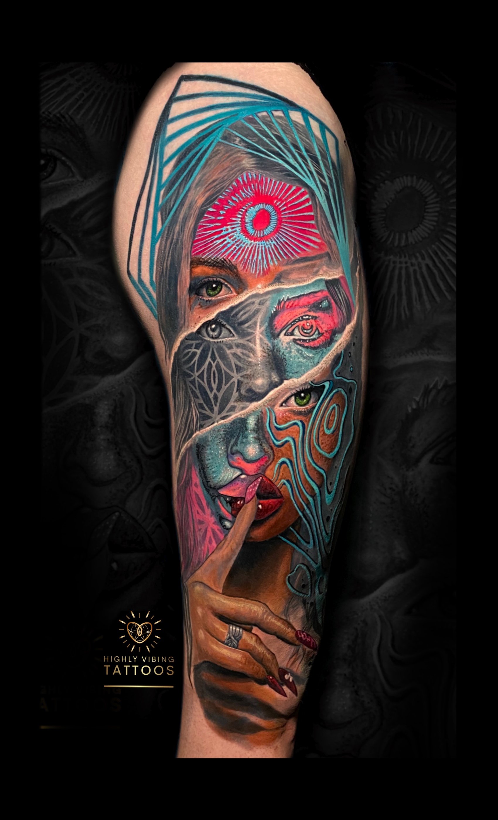 Colorful tattoo of a woman with green eyes holding a finger to her lips, featuring abstract and geometric design elements, with a pink and blue eye at the top of her forehead, detailed shading, and vibrant colors.
