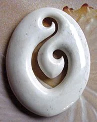 A double koru bone carving