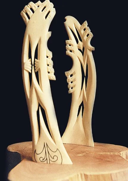 Tāne created the tree people as decoration for Papa t ū ā nuku’s cloak, as shown in the rear figure. But because they ran about and spoiled the design he reset them upside down, as in the front piece, with their limbs waving in the air and their hai…