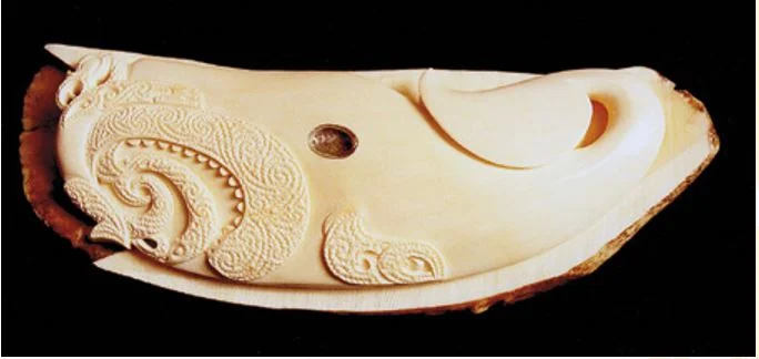 A whale tooth carved as Kewa