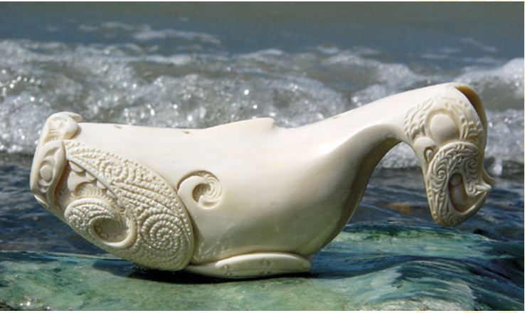 A carving from the tooth of a whale stranded at Farewell Spit