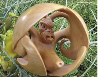 Boxwood carving of a kahukura in the form of a Japanese netsuke