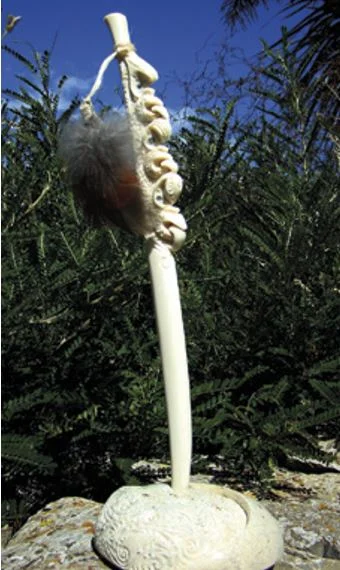 One of the three au rei carved from the tooth made into the pendants worn by Tīpene O’Regan and Bill Solomon