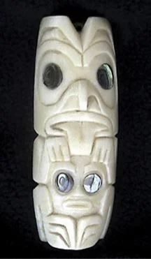 A Canadian whale tooth carving by Mark Bronson