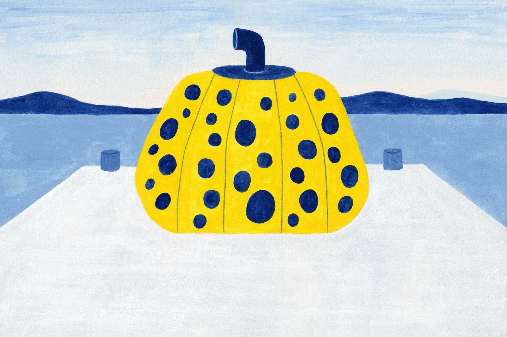 A closeup view of Naoshima's Yellow Pumpkin on the pier surrounded by blue water and distant blue mountains under a light blue sky.