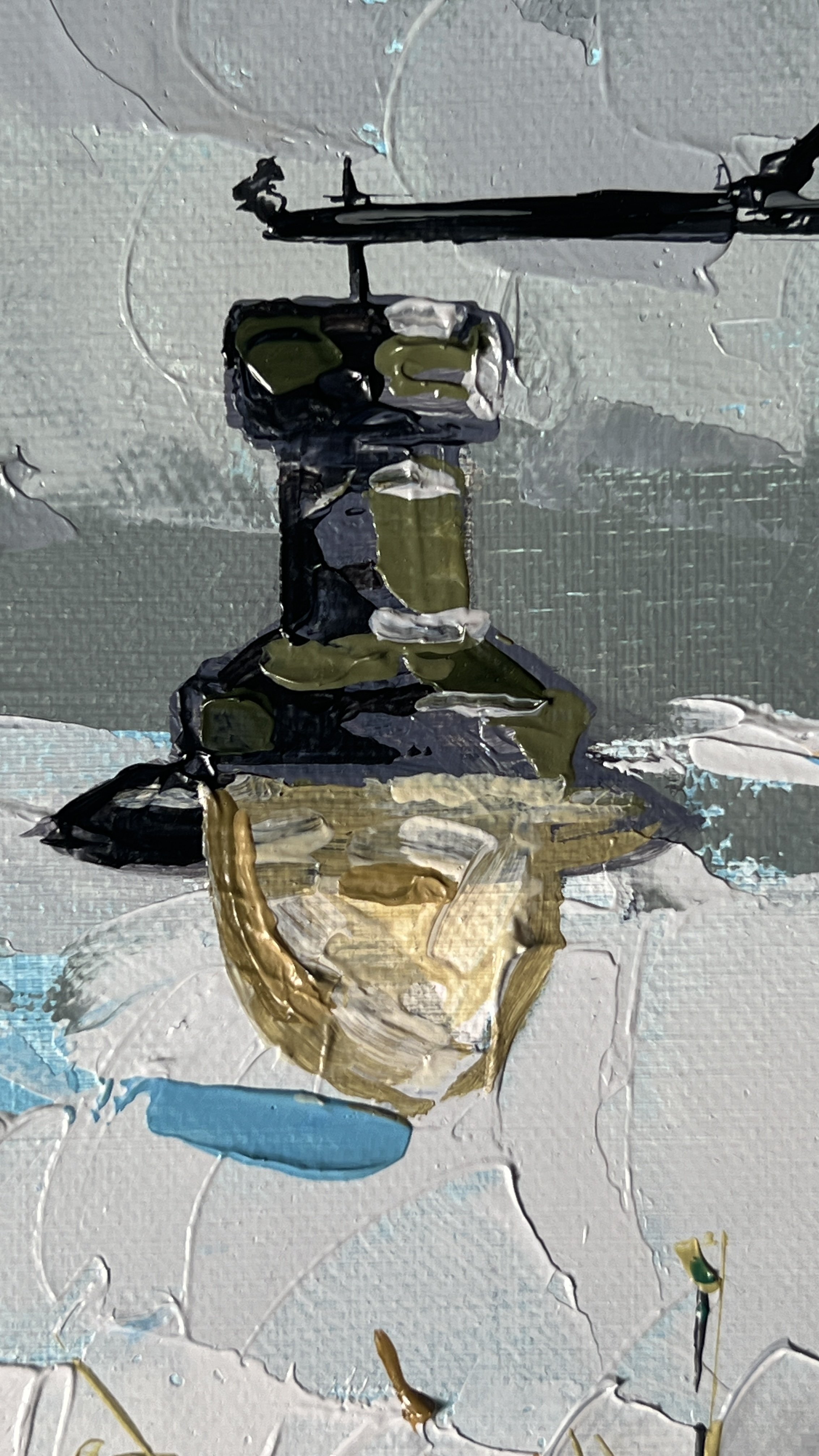 Close up detail of the street lamp. Weathered and dirty some cloud in the background can still be seen through the glass of the lamp.