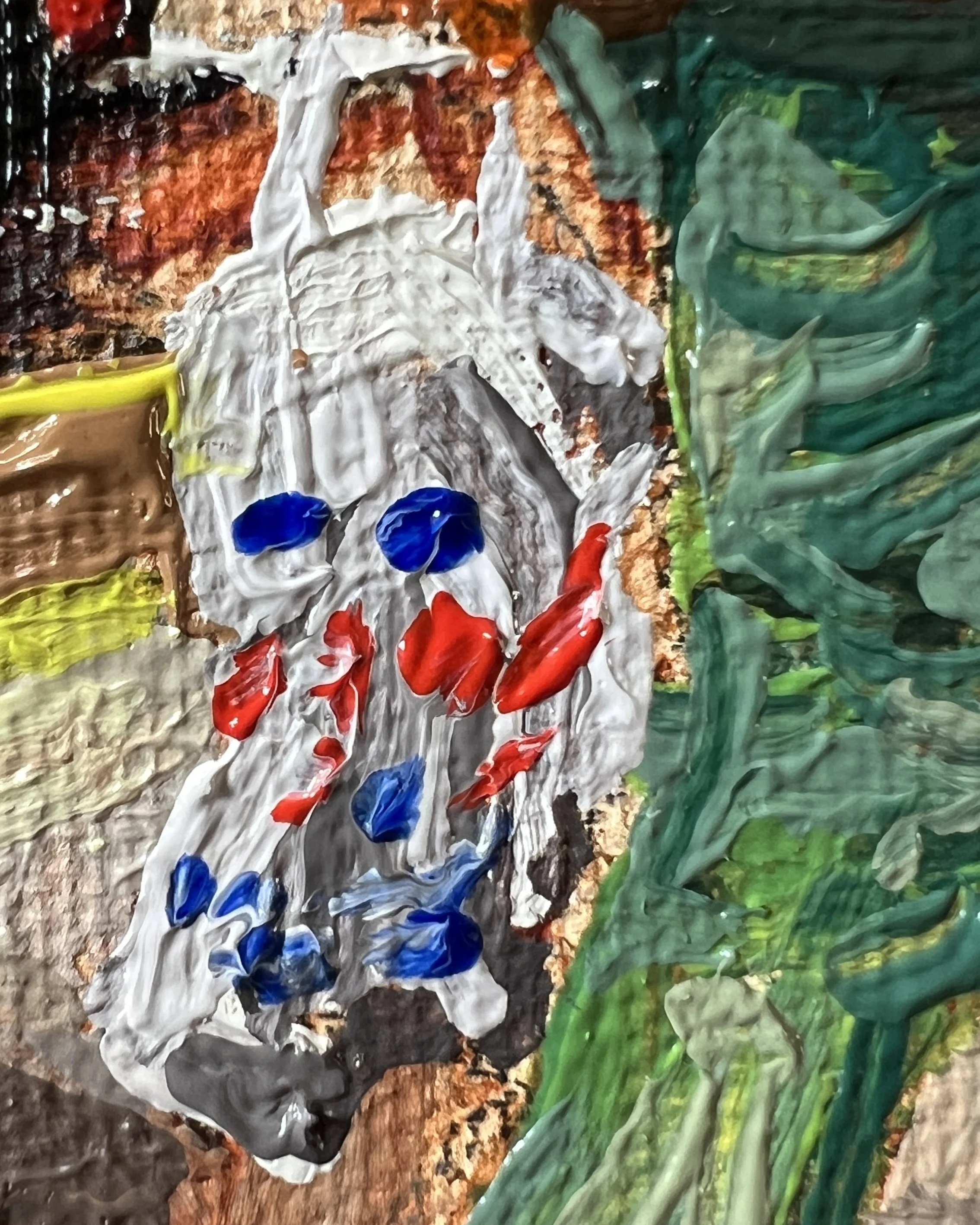 Close up detail of a Tescos shopping bag next to a green trouser leg.