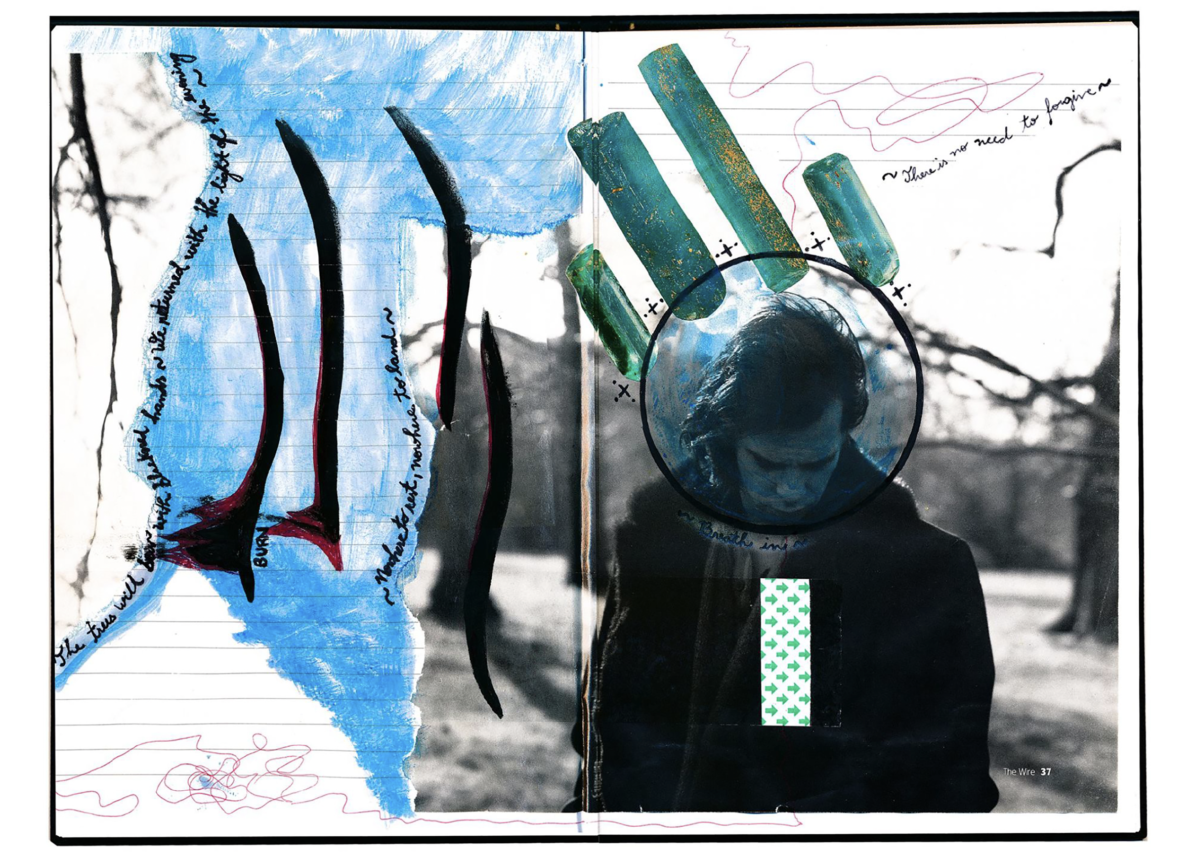 An open notebook with mixed media artwork, including blue and black ink, watercolor wash, and sketches. The left page has black ink writing along the margins and a blue watercolor background, while the right page has a circular photographic overlay o