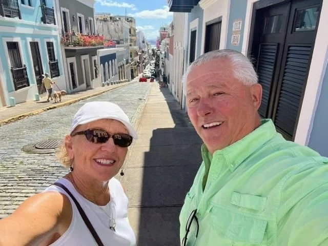 Couple on the streets of Puerto Rico smiling.