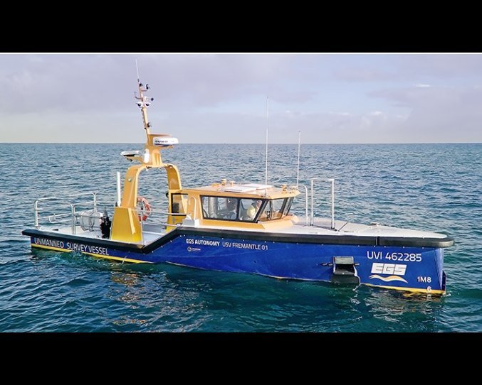 11.5m unmanned survey vessel on the water, profile view.