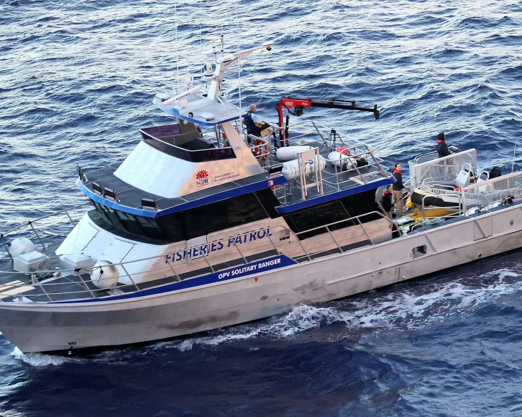 20m fisheries patrol vessel underway, aerial bow quarter view.