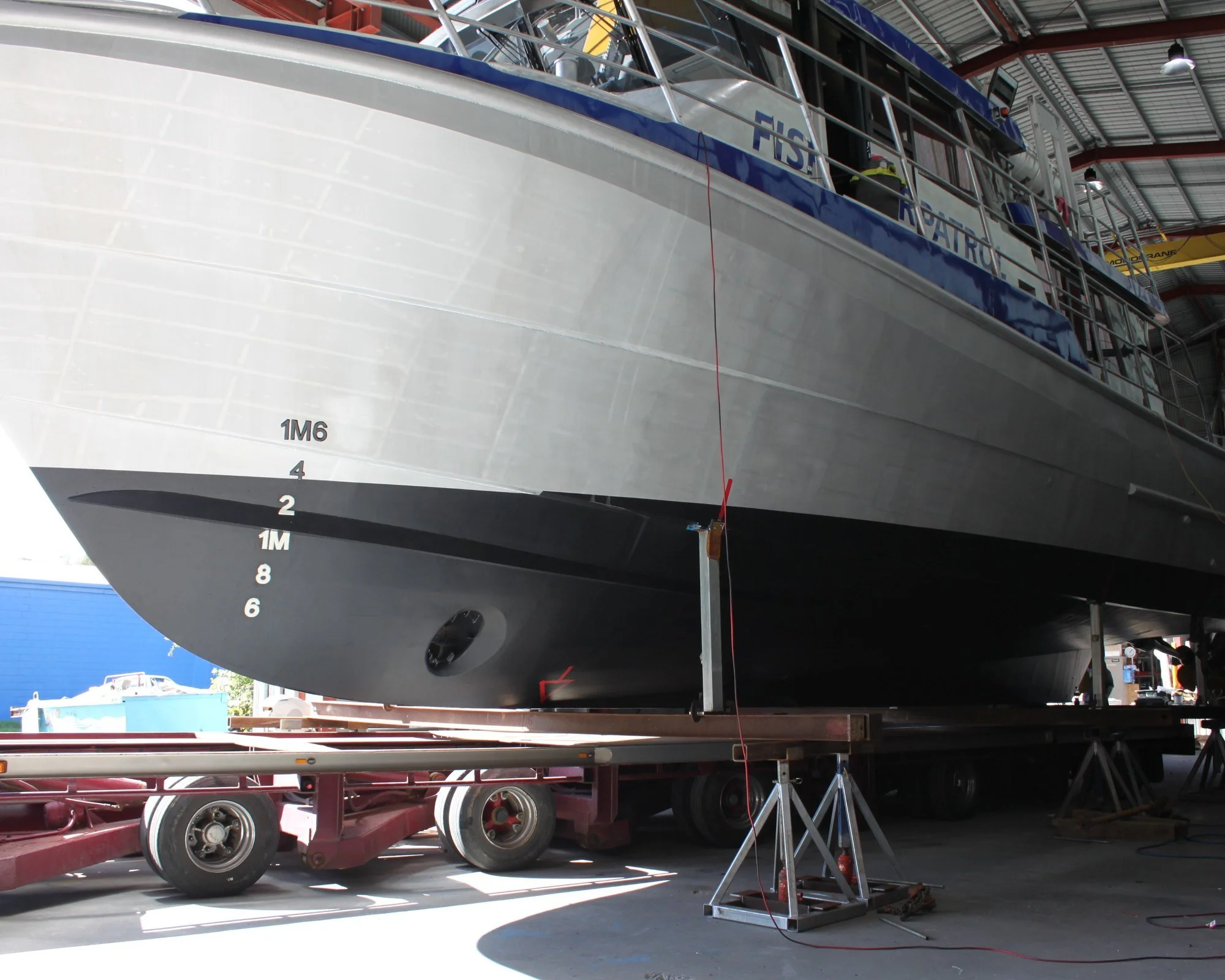 20m fisheries patrol vessel painted and nearing completion, bow view in the shipyard.
