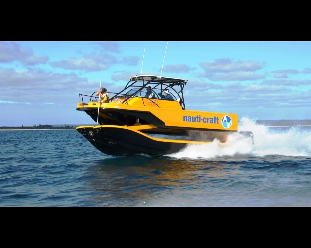8m R&amp;D catamaran 2-Play at speed, profile shot