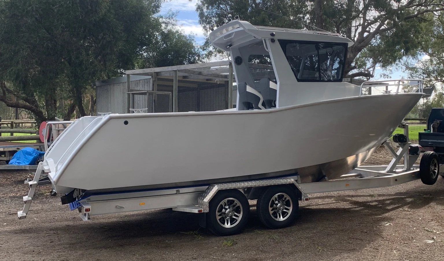 Sherwood Marine 750CCB - 7.5m Centre Cab aluminium boat kit - on the trailer, starboard side (fr windows)