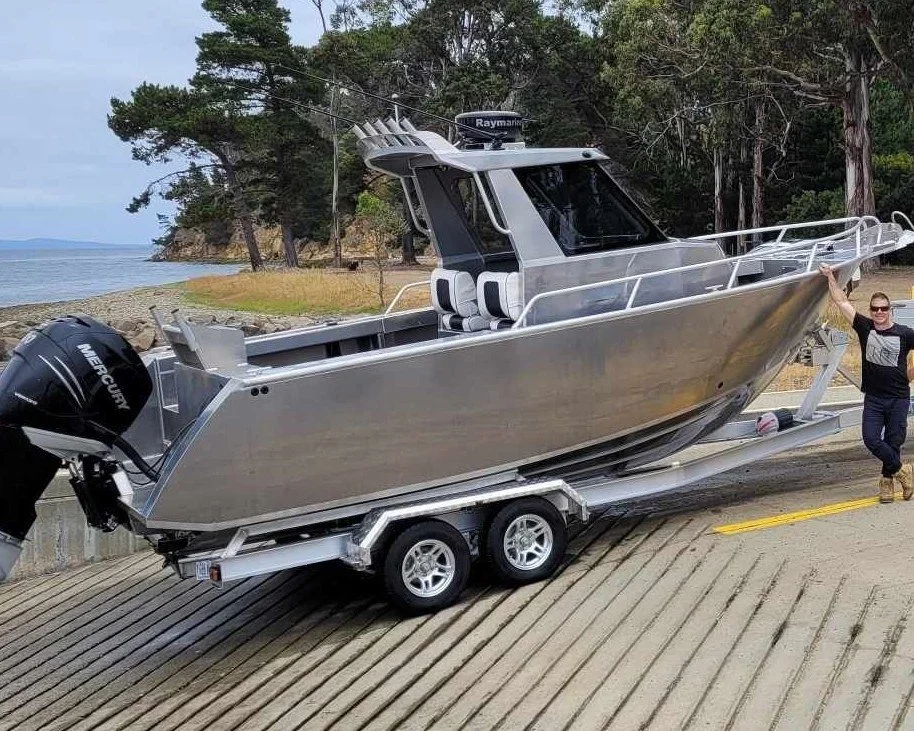 Sherwood Marine 680CCB - 6.8m Centre Cab aluminium boat kit - launching at the ramp, stern quarter
