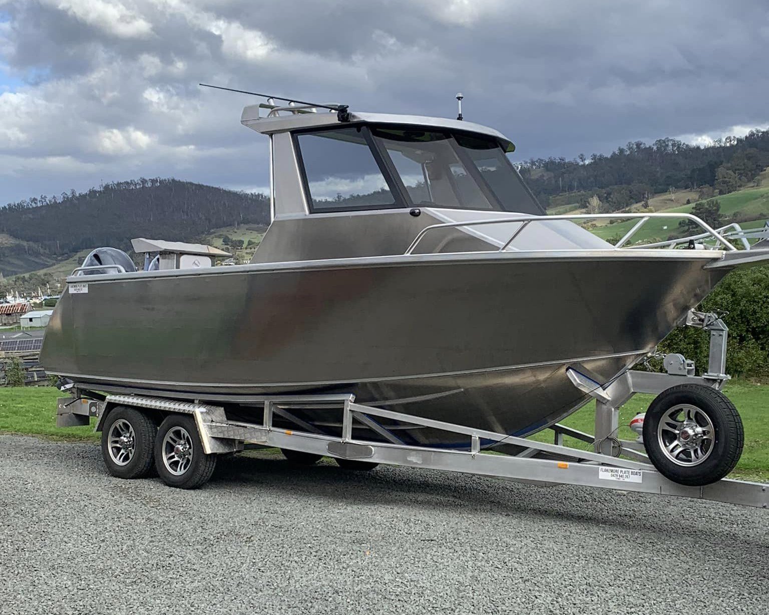 Sherwood Marine 680HT - 6.8m Hardtop aluminium boat kit - bare hull and hardtop on the trailer, starboard bow quarter
