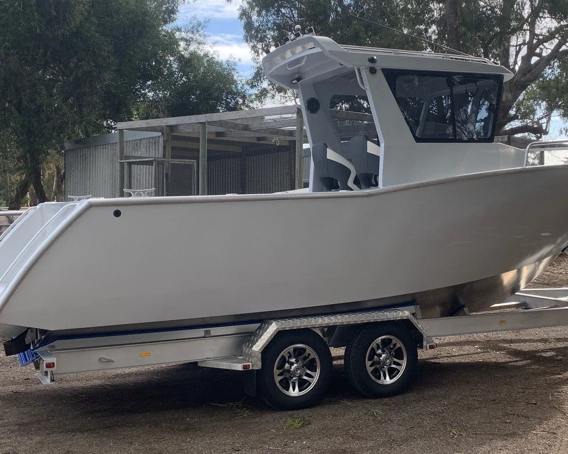 Sherwood Marine 750CCB - 7.5m Centre Cab aluminium boat kit - on the trailer, starboard bow quarter (fr windows)
