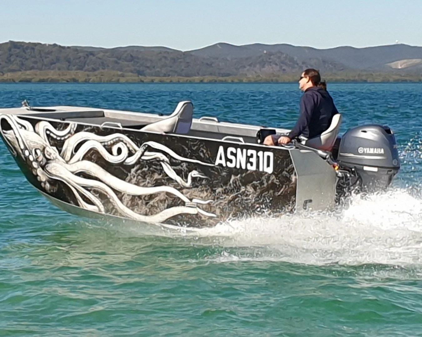 Sherwood Marine C450T tiller steer 4.5 m aluminium catamaran boat kit - on water port bow quarter
