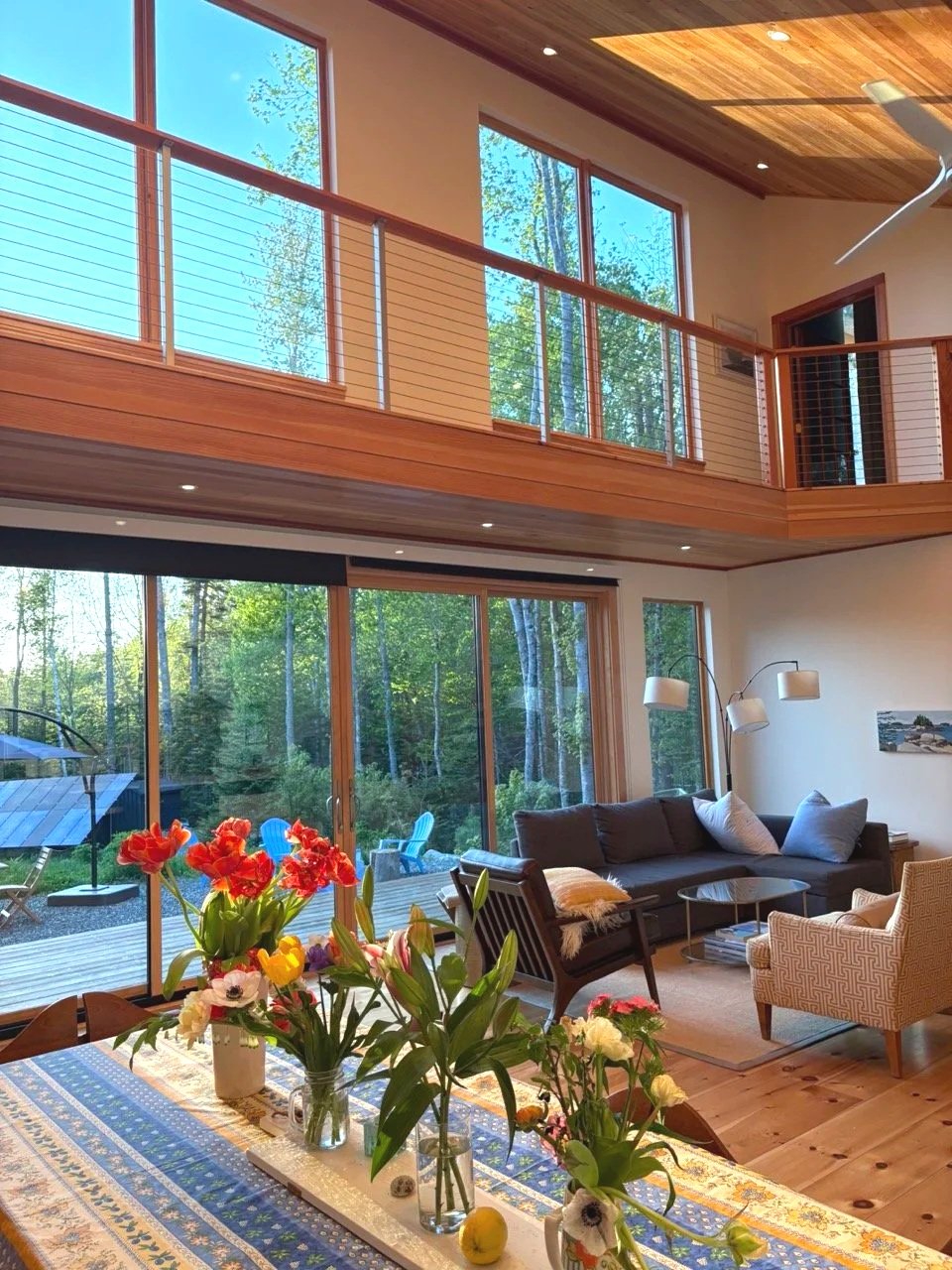 The Pond guest house, with woodland views, a dining table, and a comfortable living area
