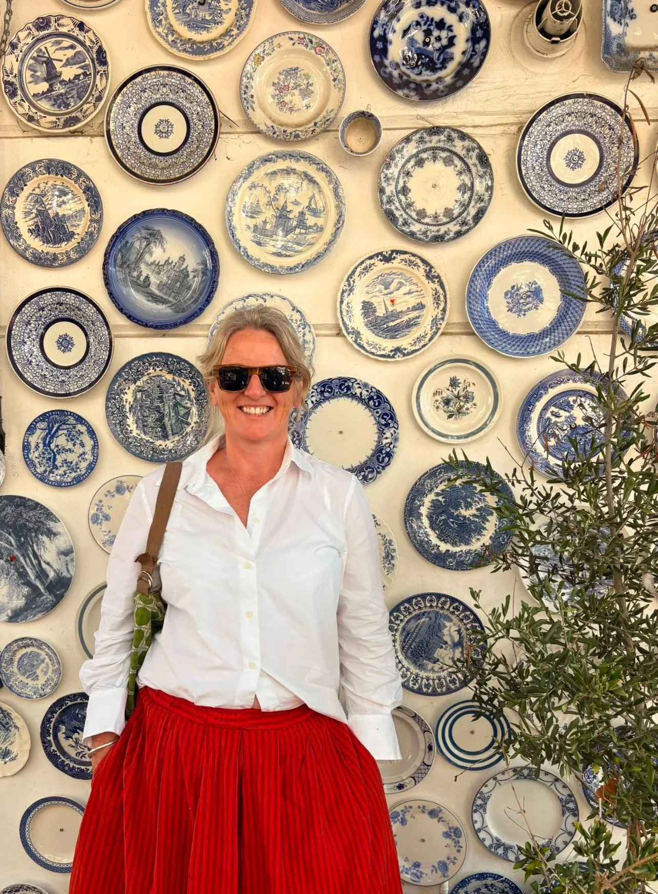 Dr Jo Black, Consultant Perinatal Psychiatrist, smiling outdoors in an nice smart casual outfit.