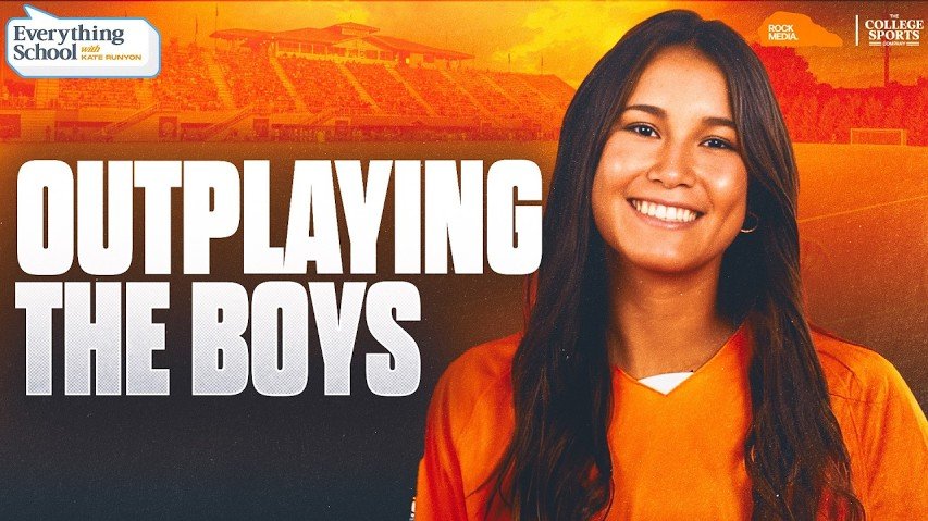A young woman with long dark hair smiling, wearing an orange sports jersey, stands in front of a sports stadium background with the text 'Outplaying the Boys' and logos for 'Everything School' and 'The College Sports'.