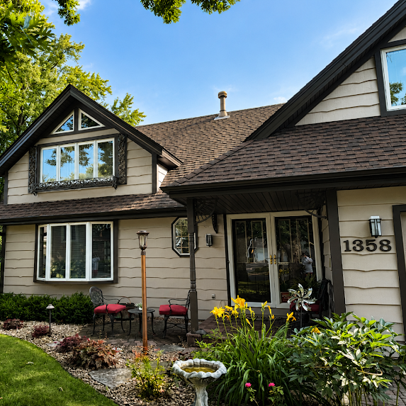Eagan Exterior Painting project. This took us three days to complete. We used a light brown color for the siding and a dark trim color for the trim , eaves, and fascia. We used Sherwin Williams Emerald Rain Refresh paint.