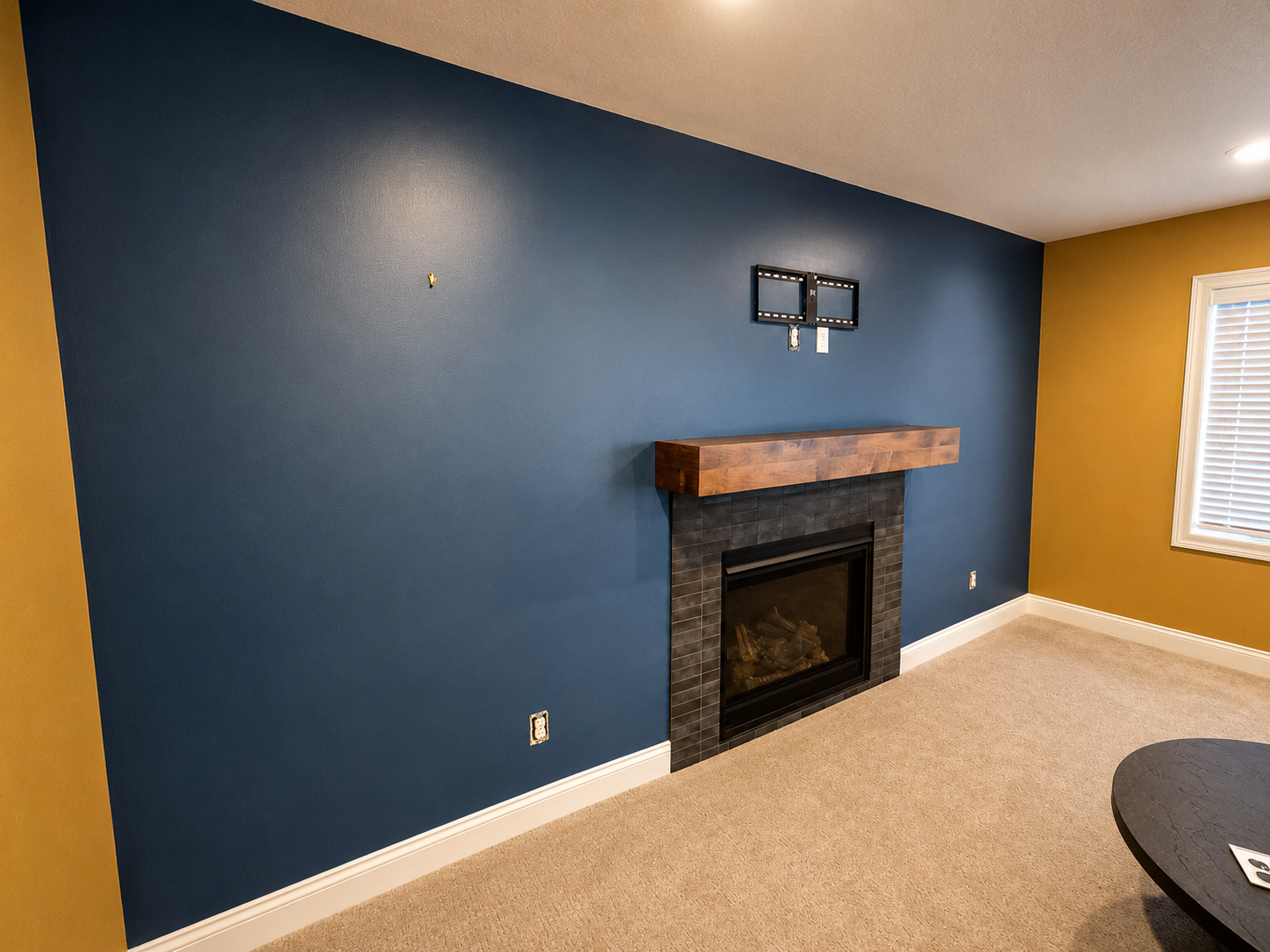 Blaine interior painters. We painted this basement in a blaine home in one day. The homeowner chose the color Butternut by Sherwin Williams for the main color with a blue accent.