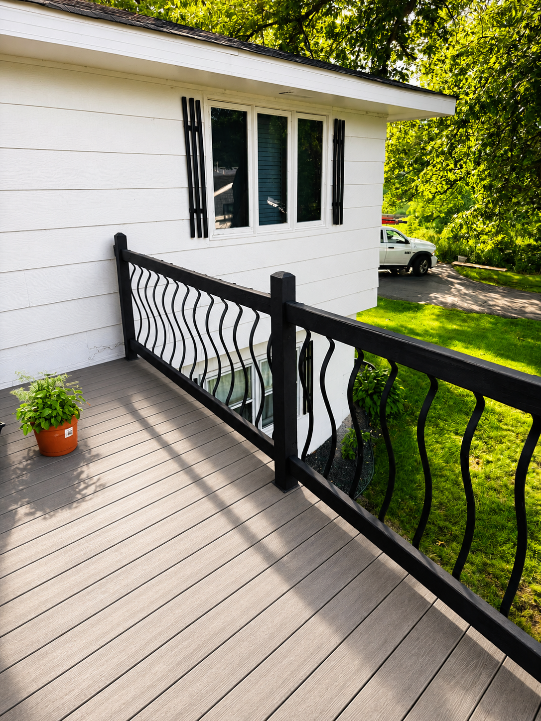 Deck staining Prior lake mn. We restained this deck railing in just a few hours. We used the color Tricorn Black by Sherwin williams.