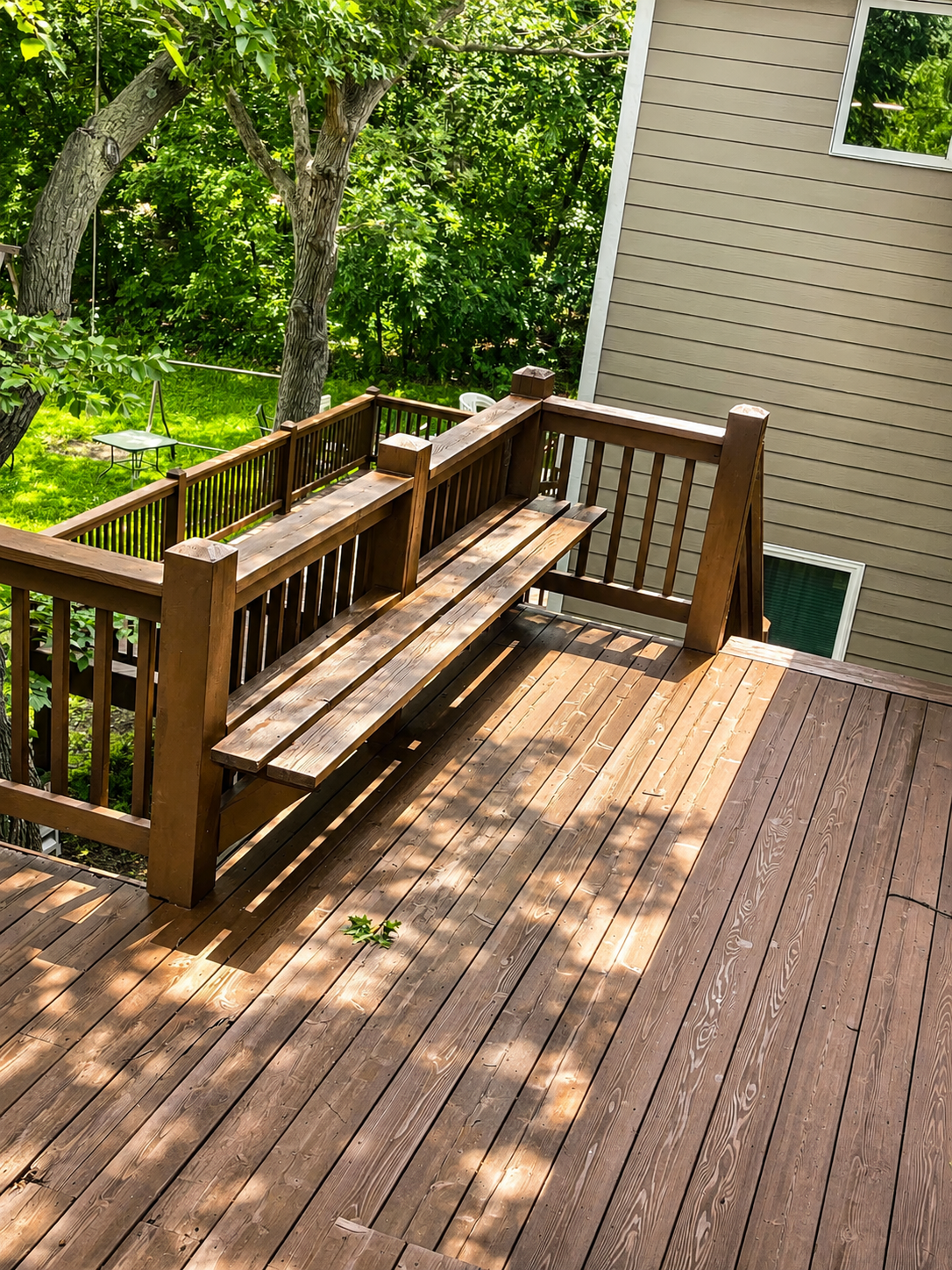 Deck staining in Blaine, MN. We restained this large deck using Woodscapes Stain by Sherwin williams.