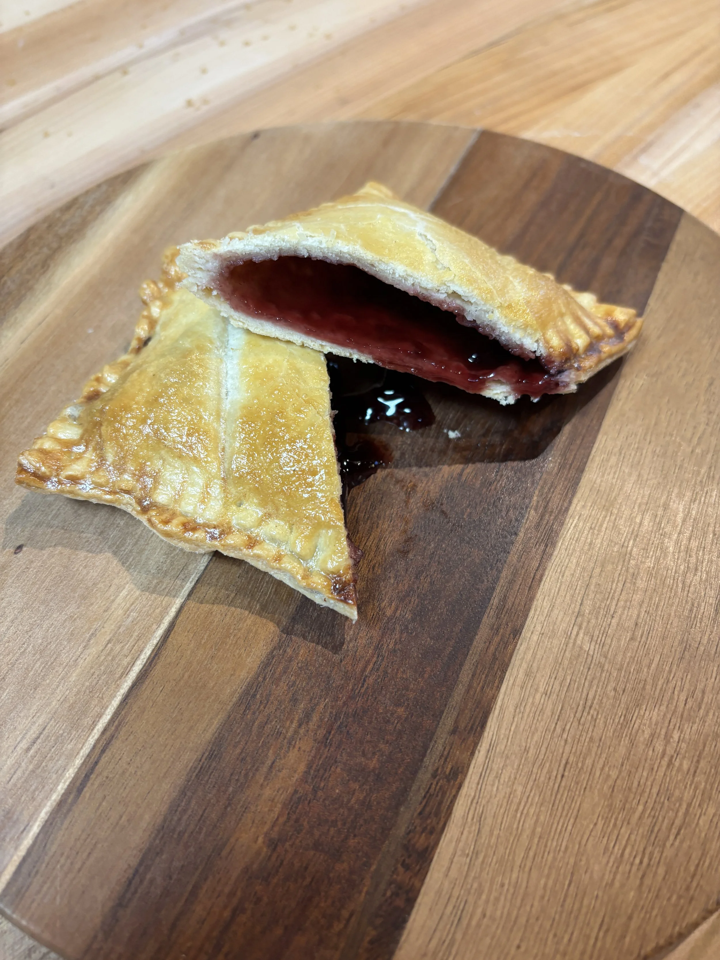 Hearty sourdough crust hand pie filled with blackberry jam