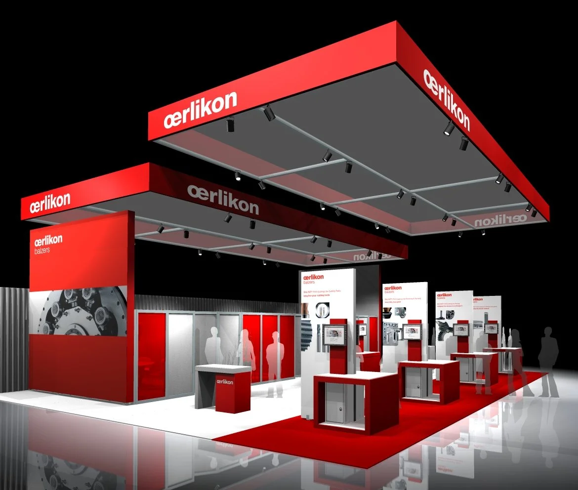 Trade show booth for Eerlikon Balzers, featuring red and white branding, display panels with product graphics, and seating areas, set against a black background.
