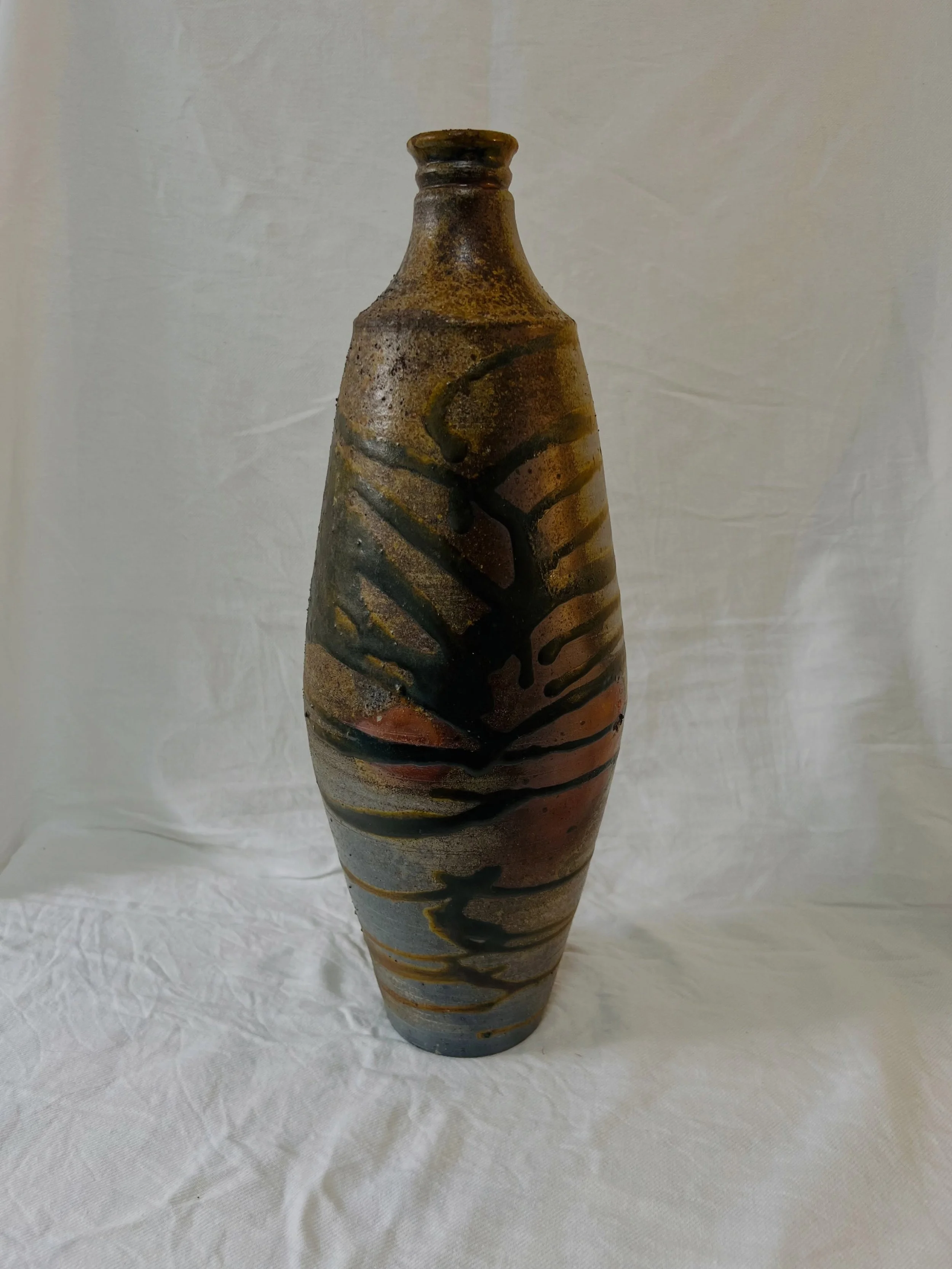 This very big bottle was under the side stoke hole in @nic.collins.75 &lsquo;s kiln, fired for over 80 hours. It has a gnarly side, as you can imagine, but also this wonderful stripy, expressive side.