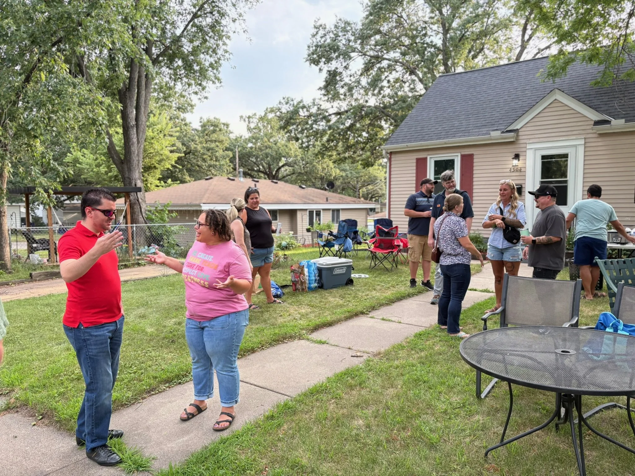 Cristin talks to voters at a neighborhood gathering.