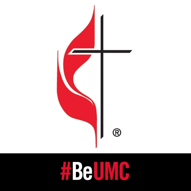 A logo with a red flame and a black church cross, and the text '#BeUMC' below in red and white.
