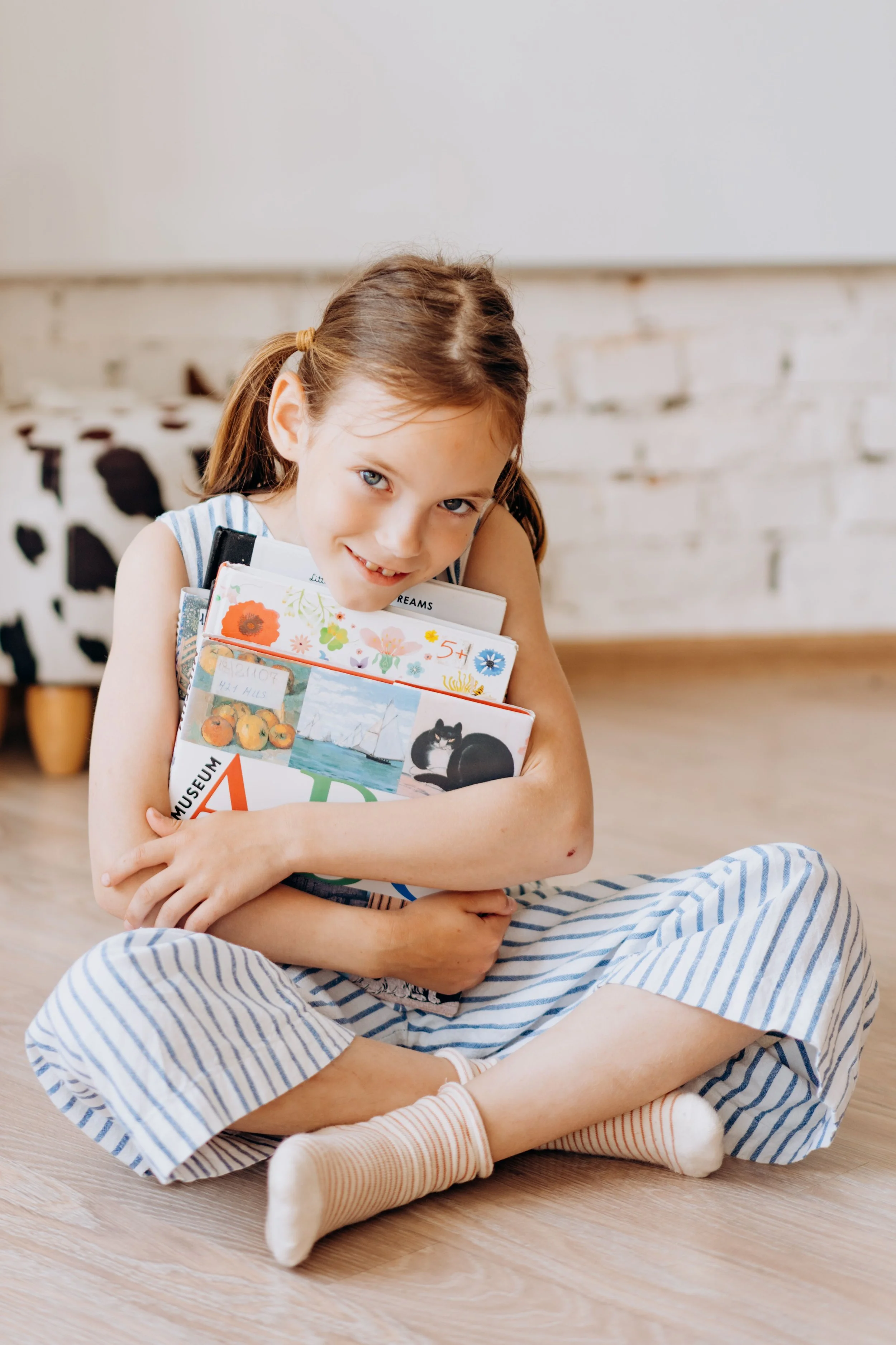 Child building confidence and intrinsic joy through personalized reading instruction.