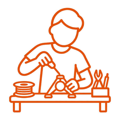 Person working with tools and craft supplies on a workbench.