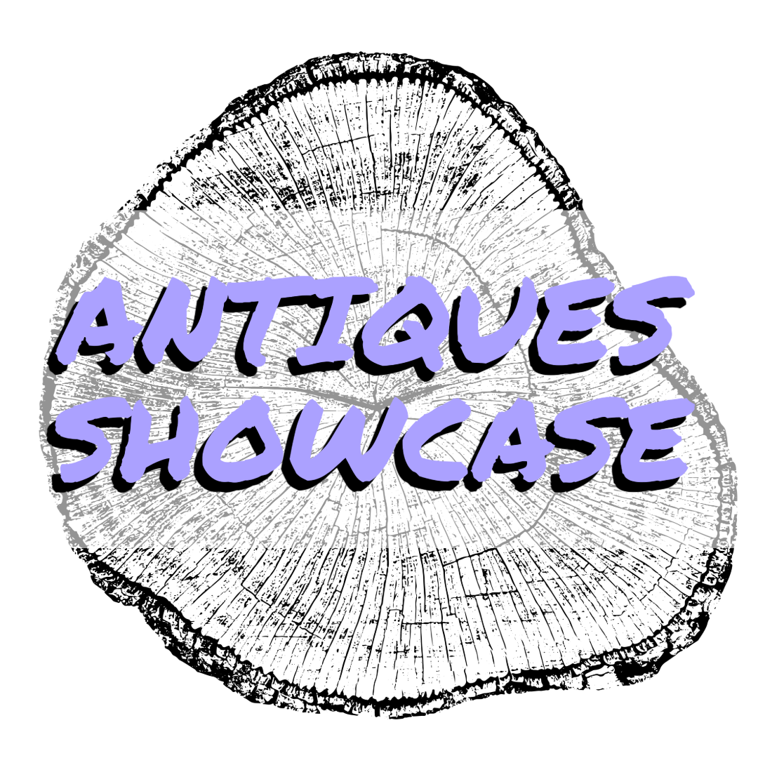 A black and white illustration of a cross-section of a tree trunk with the words 'Antiques Showcase' written in purple with a black shadow across the center.