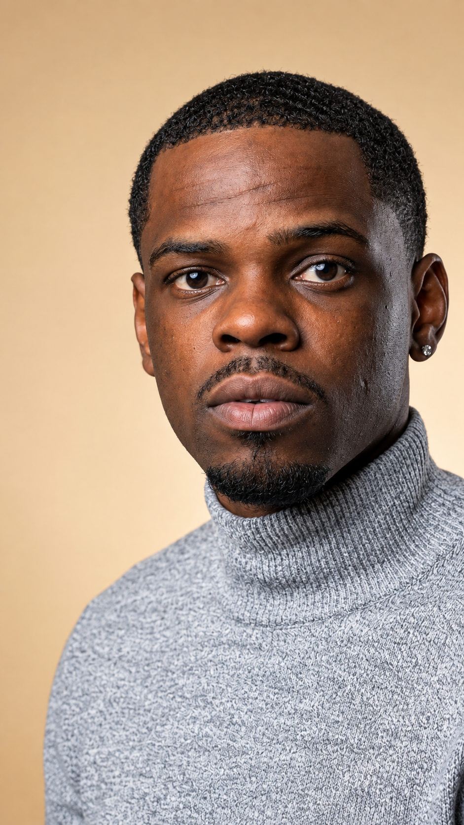 Terry Godfrey, Charlotte real estate investor and founder of Equity Empire Group, in a gray turtleneck headshot