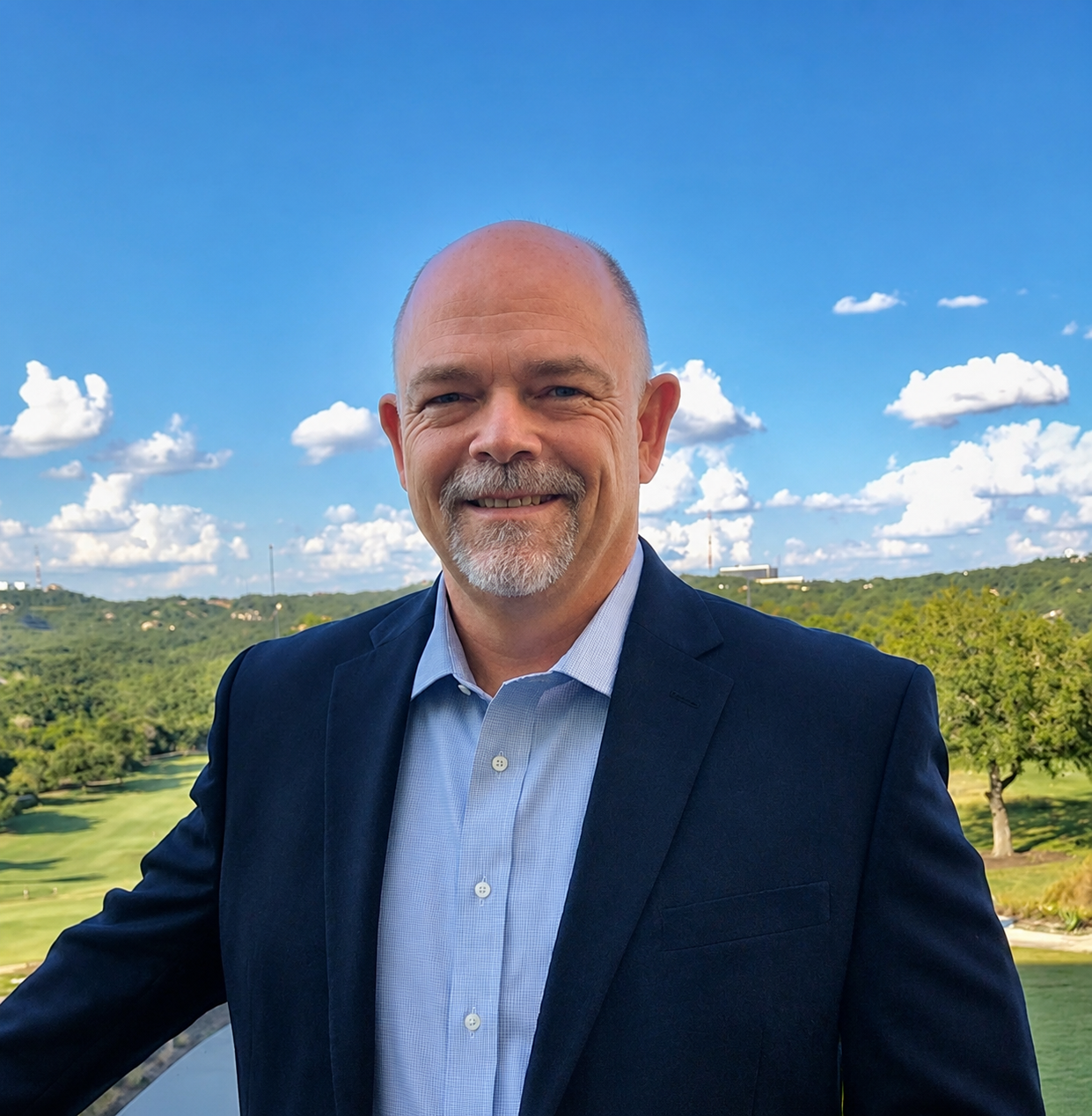 Jim standing in front of the Austin Texas hill country