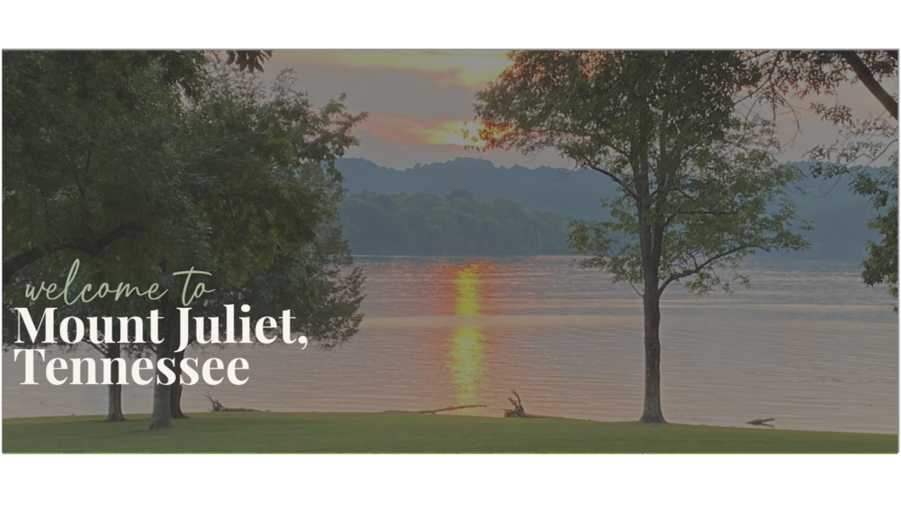 Sunset over a lake with trees in Tennessee, welcoming visitors to Mount Juliet.
