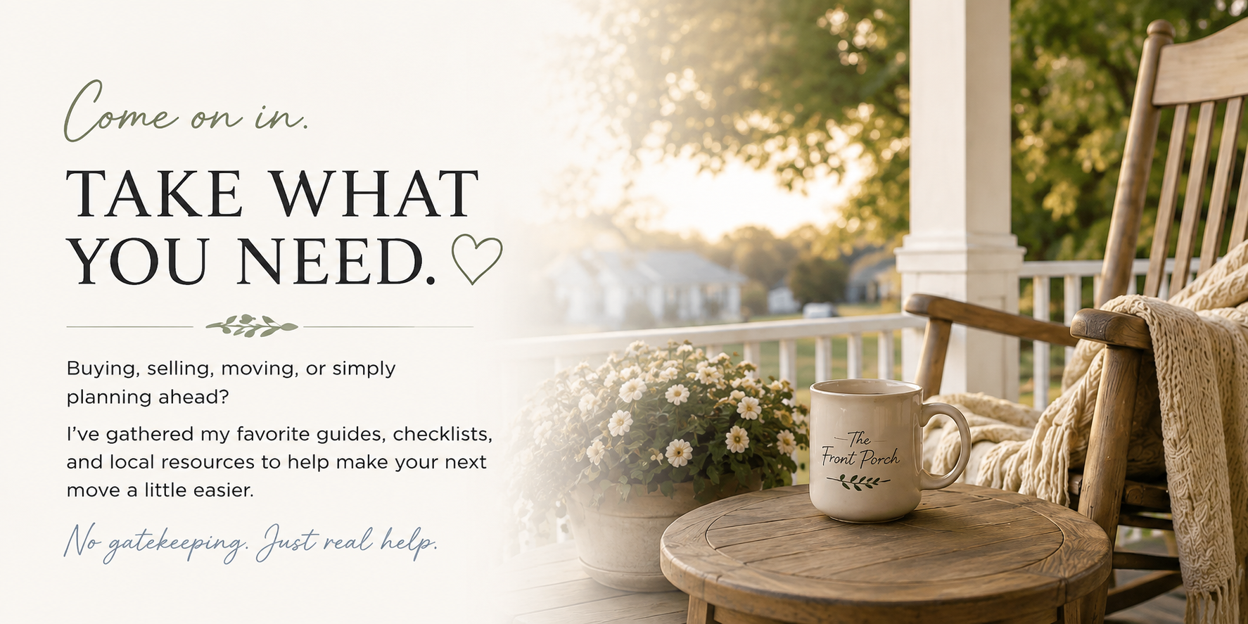 A porch scene with a wooden chair, a blanket, a flower pot with white flowers, and a mug on a small round table, with trees and houses in the background during sunset.