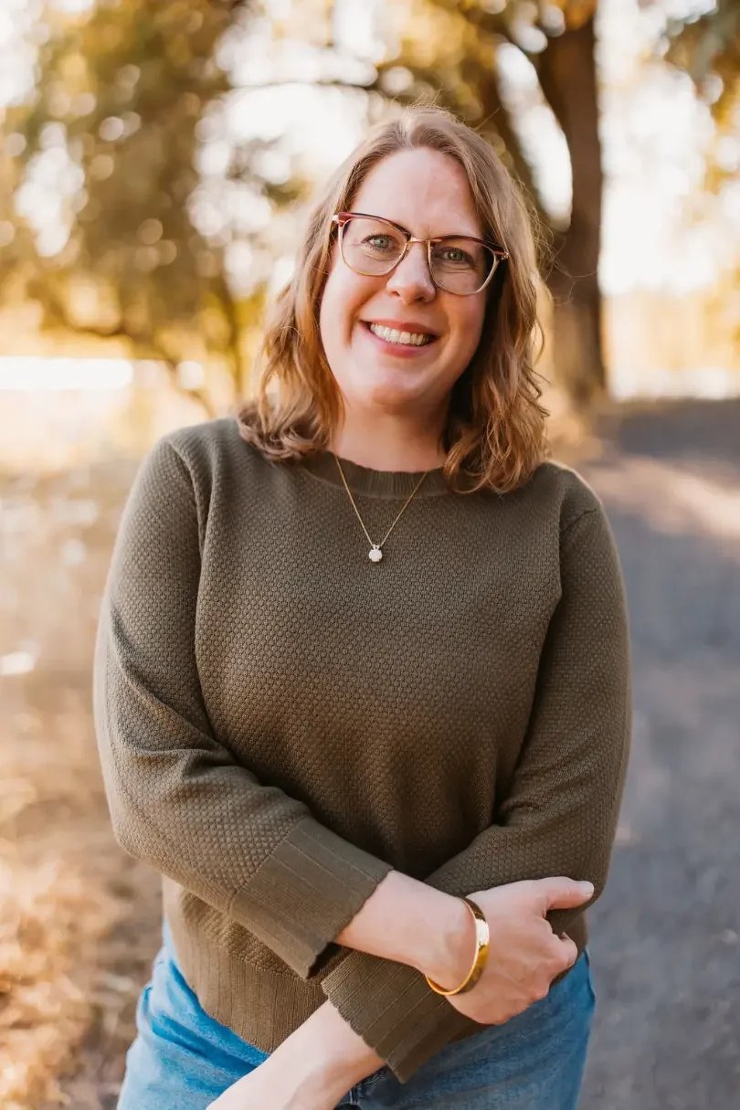 Ashley Sullivan, LCSW, smiling outdoors near Portland, Oregon