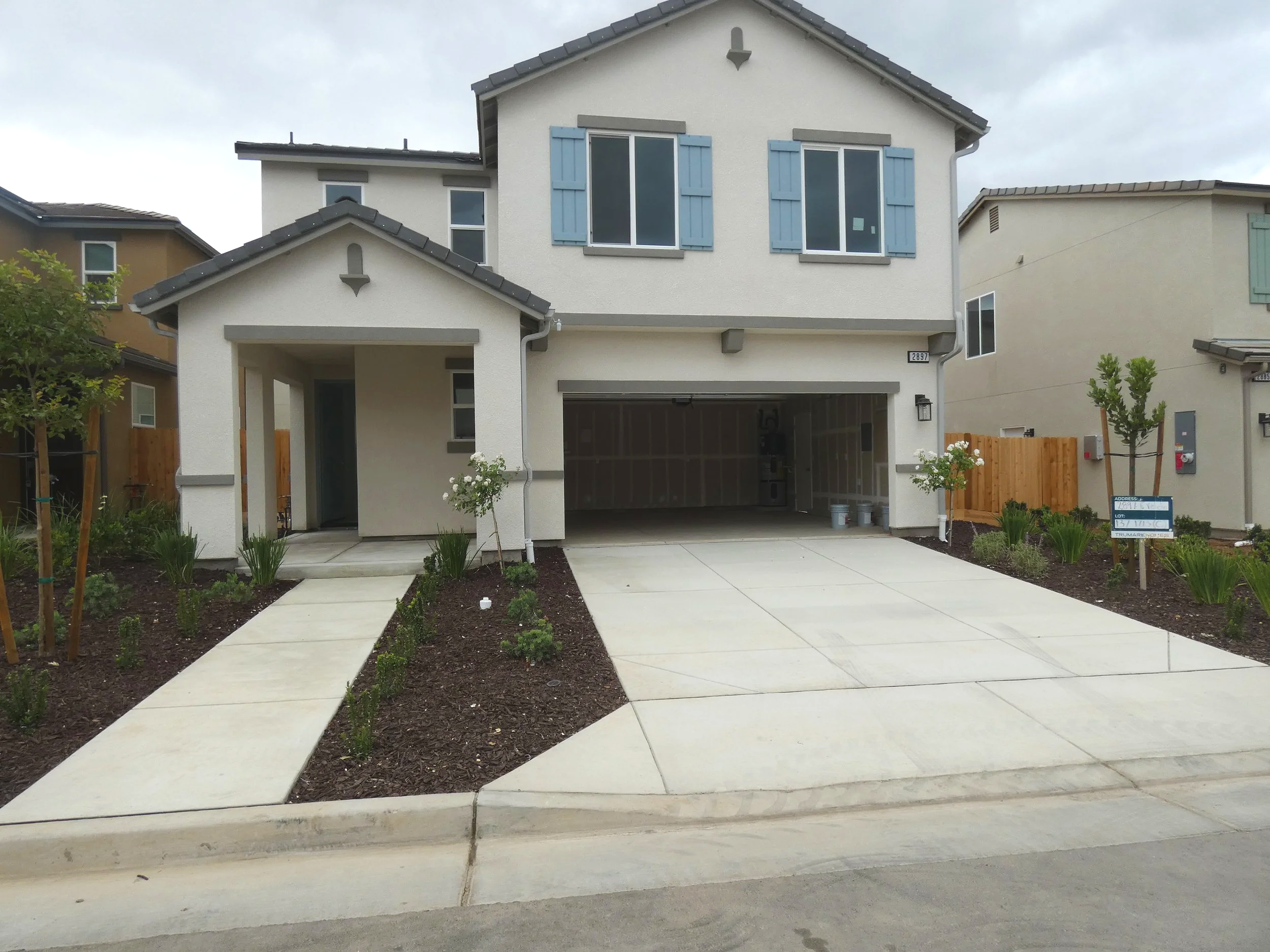 Modern two-story house with good curb appeal and a built-in two car garage.