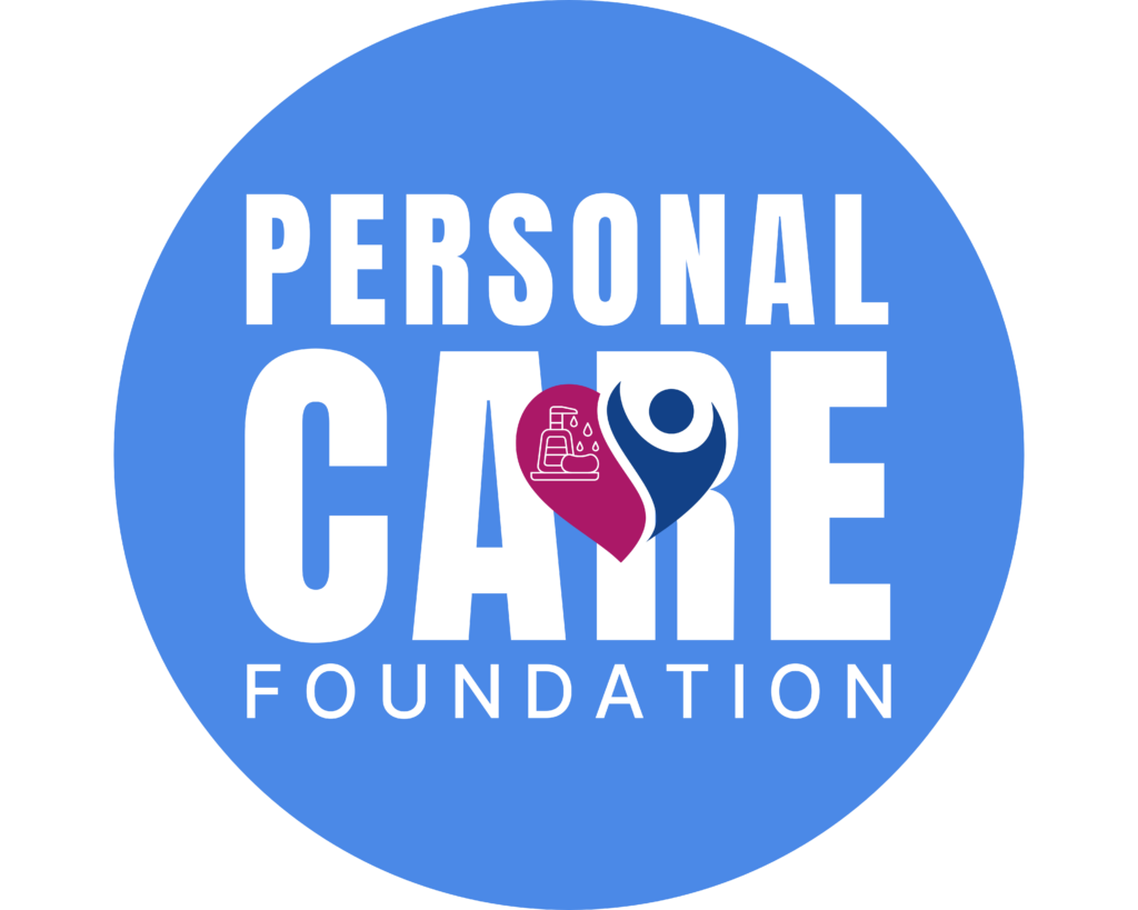 Logo of Personal Care Foundation with the words 'Personal Care Foundation' in white on a blue circle, with a stylized face made of a hand with soap and a water drop, and a person icon represented by a circle and a dot.